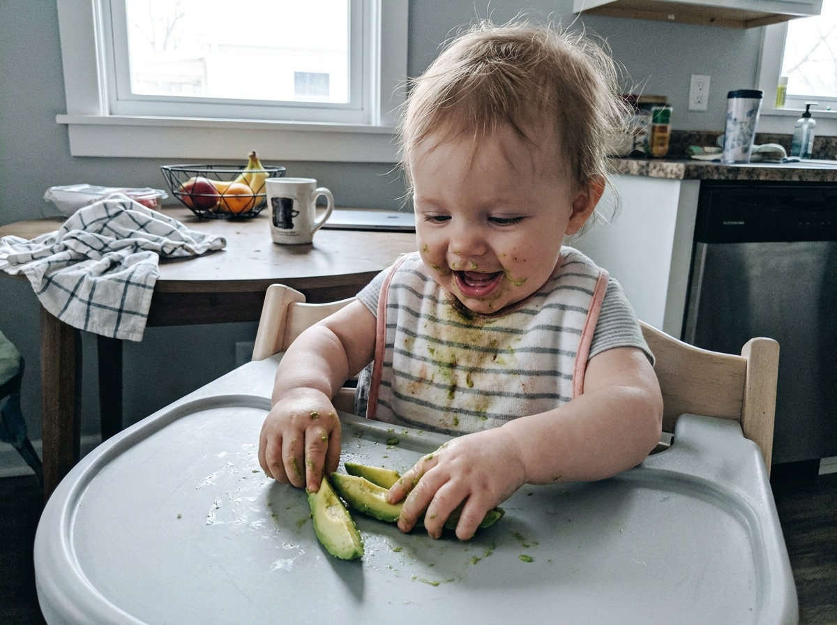 Toddler with avocado